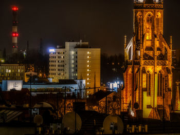 Illuminated buildings in city at night