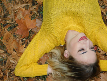 Portrait of woman with yellow leaves