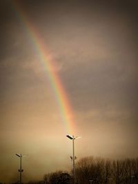 Rainbow against sky at sunset