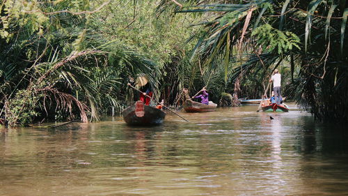 Group of people on boat in river