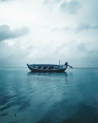 Boat in sea against sky