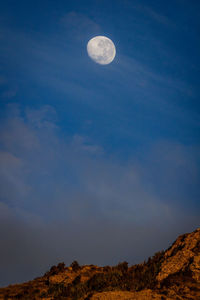 Low angle view of moon against sky at night