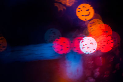 Close-up of multi colored illuminated lighting equipment in water