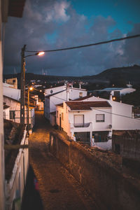 Illuminated city against sky at night