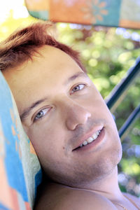 Close-up portrait of smiling young man
