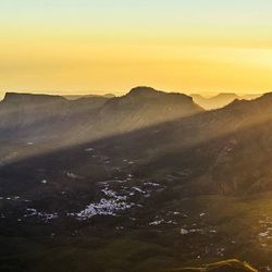 Scenic view of mountains at sunset