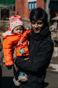 Full length of father and son during winter