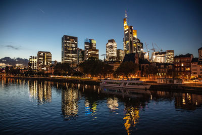 Reflection of illuminated buildings in water