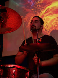 Man playing drum during concert