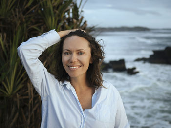 Portrait of woman at ocean coastline