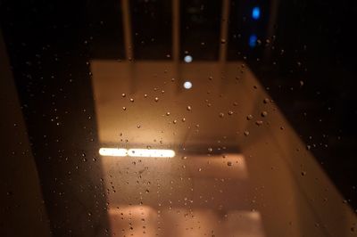 Close-up of wet glass window in rainy season
