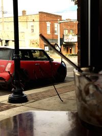 Cars on street by buildings in city