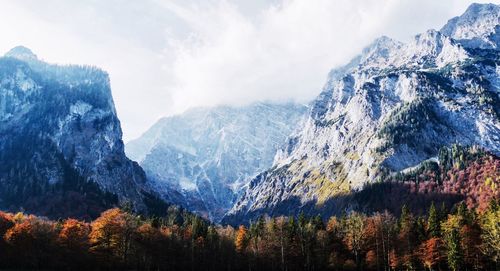 Scenic view of mountains against cloudy sky