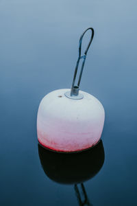 High angle view of buoy floating in lake