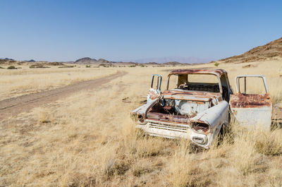 Abandoned truck in desert against clear sky, namibia, africa