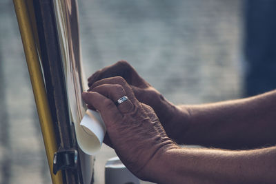 Close-up of man holding hands