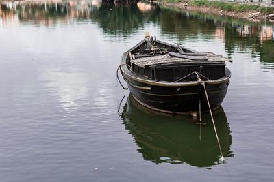 Boat moored in lake