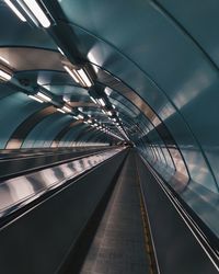 Low angle view of illuminated escalator