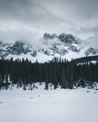 Scenic view of snow covered mountains against sky