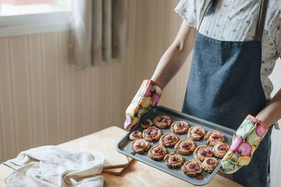 Midsection of man preparing food at home