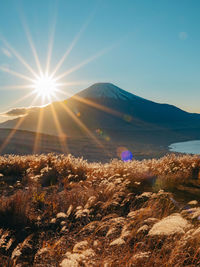 Scenic view of mt fuji against sky on sunny day