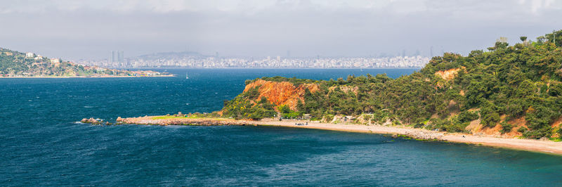 Scenic view of sea against cloudy sky