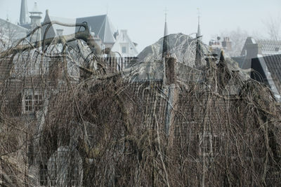 Panoramic view of buildings in city against sky