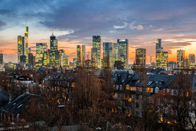 High angle view of buildings against cloudy sky