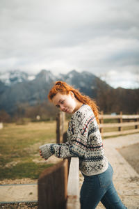 Full length of young woman against mountains