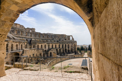 Old ruins of building against cloudy sky