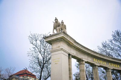 Low angle view of statue against sky