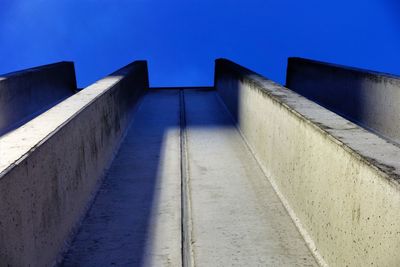 Low angle view of building against clear blue sky