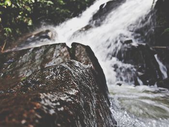 Close-up of water flowing through rocks