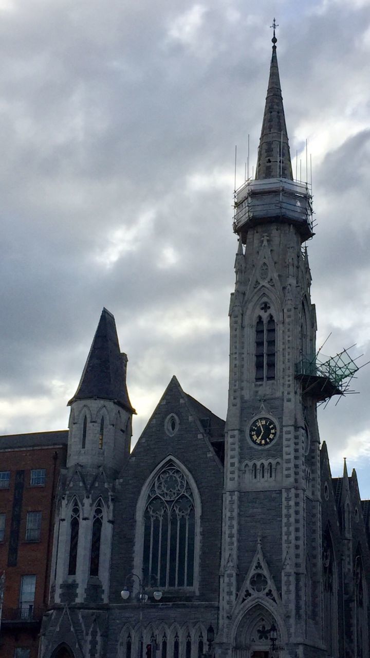 religion, spirituality, place of worship, architecture, building exterior, sky, tower, built structure, cloud - sky, clock tower, low angle view, no people, outdoors, day, city, bell tower, clock