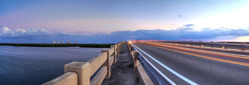 Panoramic view of highway against sky during sunset