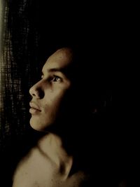 Portrait of young man looking away