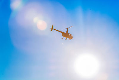 Low angle view of airplane flying in sky