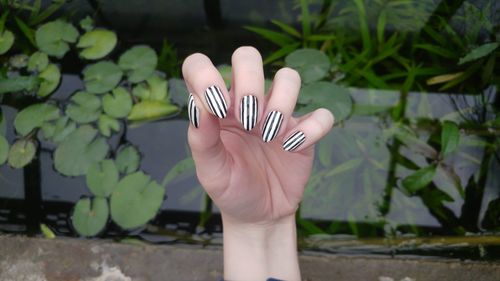 Close-up of woman with nail art