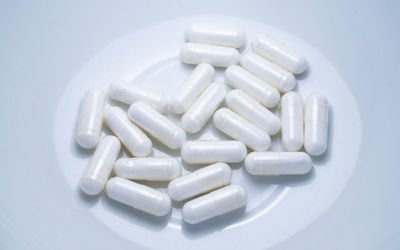 Close-up of pills on white background