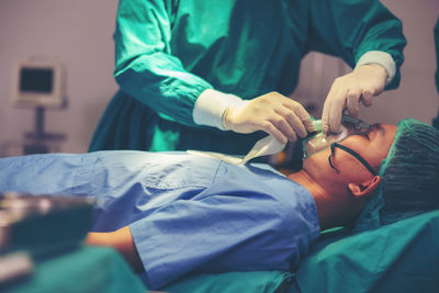In a modern operating room, a medical team is doing a surgical operation, with professional medical.