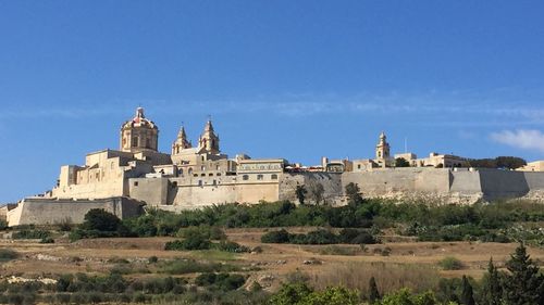 View of temple against blue sky