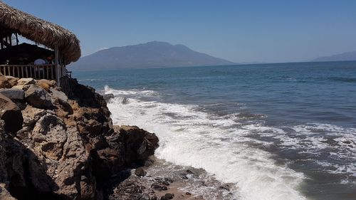 Scenic view of sea against clear blue sky