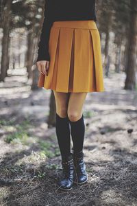 Low section of woman standing on ground