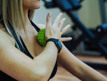 Close-up of woman holding fruit