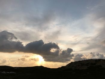 Low angle view of dramatic sky during sunset