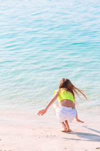 Rear view of woman on beach