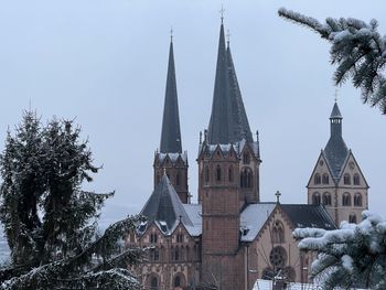 Traditional building against sky during winter