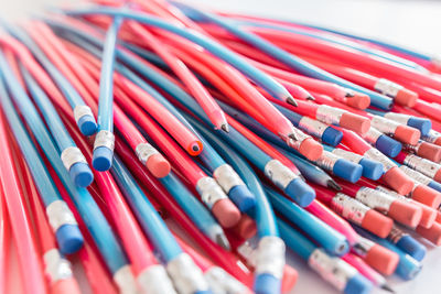 Close-up of pencils over white background