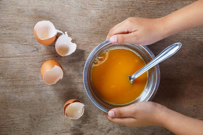 High angle view of woman preparing food on table