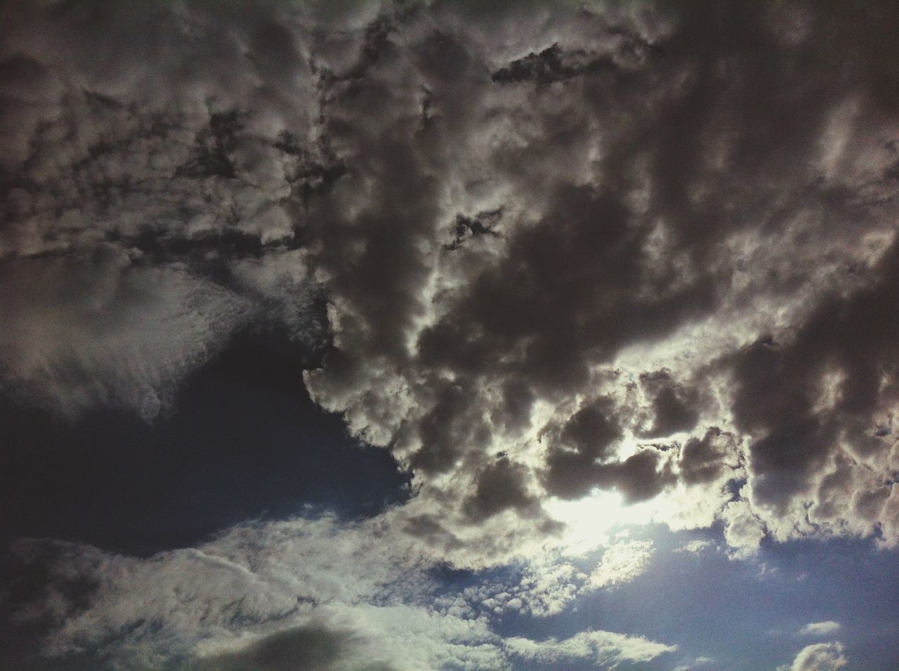 cloud - sky, sky, cloudy, weather, beauty in nature, scenics, low angle view, cloudscape, nature, tranquility, tranquil scene, cloud, overcast, storm cloud, sky only, idyllic, outdoors, dramatic sky, no people, dusk